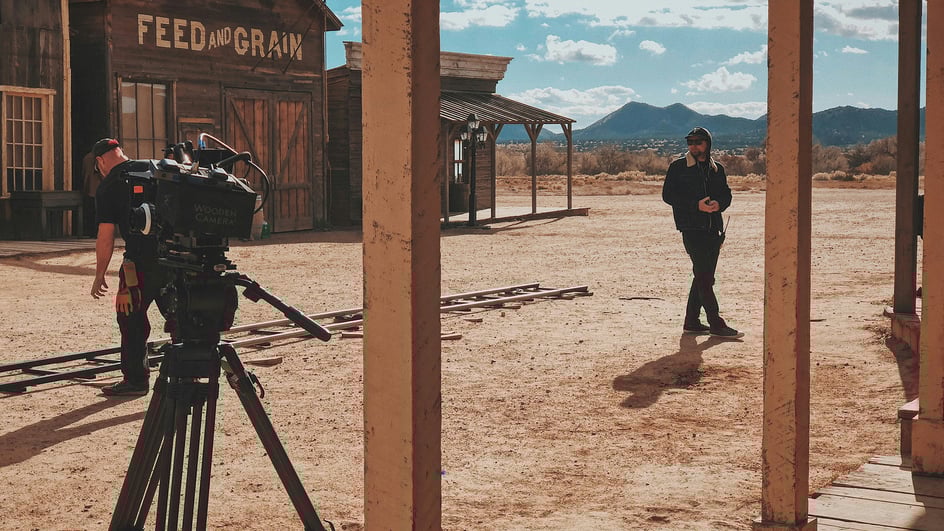  A film crew sets up in an old style Western town, ready to shoot a project that will require copyright free music for short films.