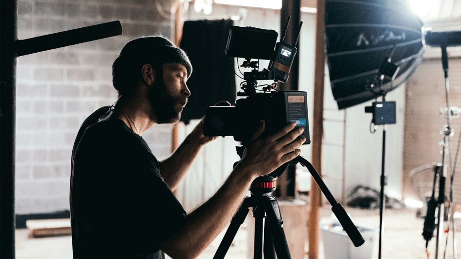 A solo business shreditor sets up his shot in studio.