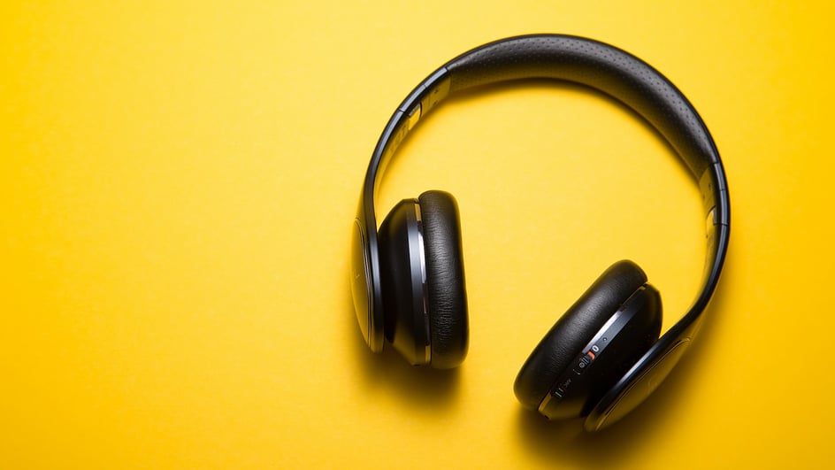  Black headphones on a yellow background