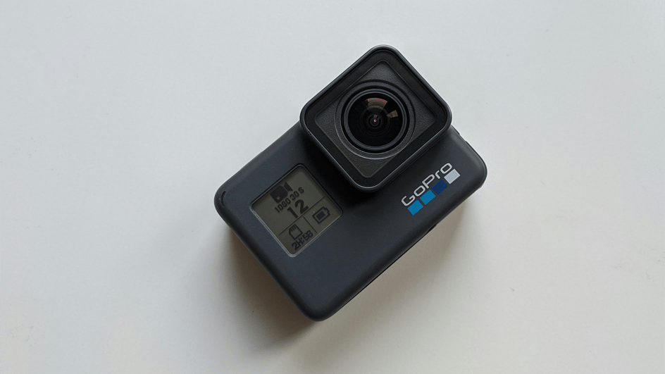  A GoPro camera sits on a white background,ready to create footage to pair with royalty free music for GoPro videos.
