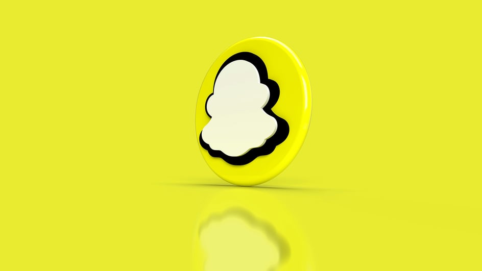  A 3D Snapchat logo is shown on a yellow background, as users learn how to use copyrighted music on Snapchat