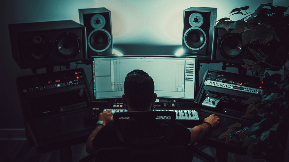  A music producer works on sound mixing vs sound editing in a recording studio, using the additional dialogue recording