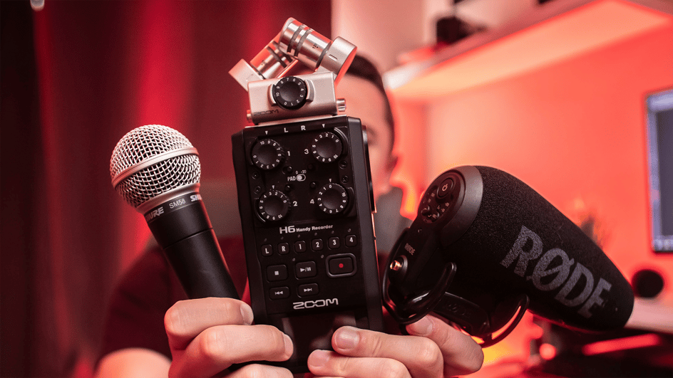  A creator holds up three different sound recording devices, capable of capturing room ambient sound to be used for room tone downloads.