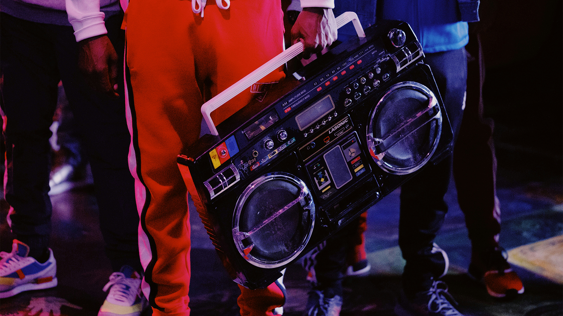 Person holding ghettoblaster, playing royalty free phonk music