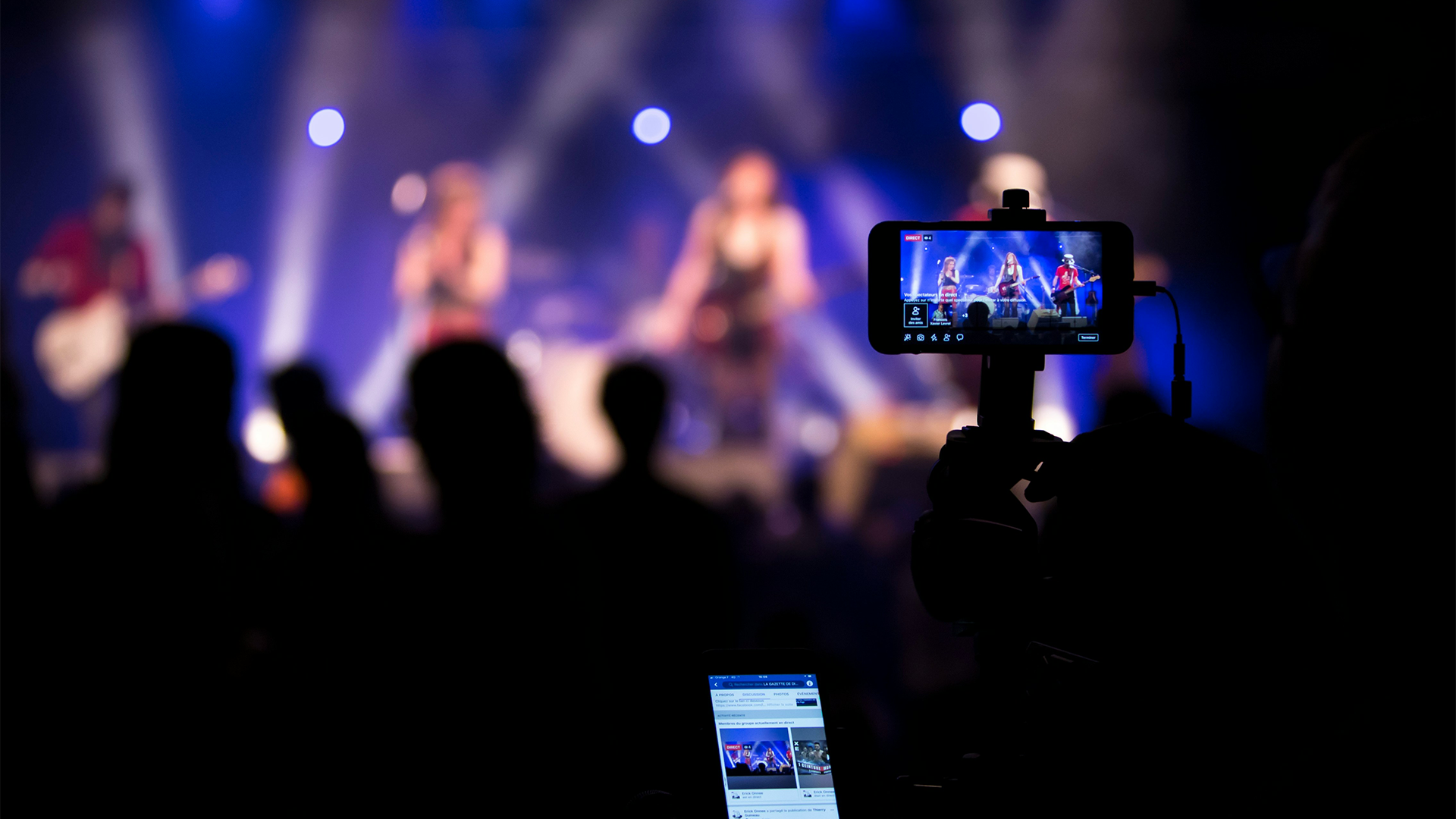 A content creator is live streaming a concert, while he decides on what patreon copyright music will be perfect for the video.
