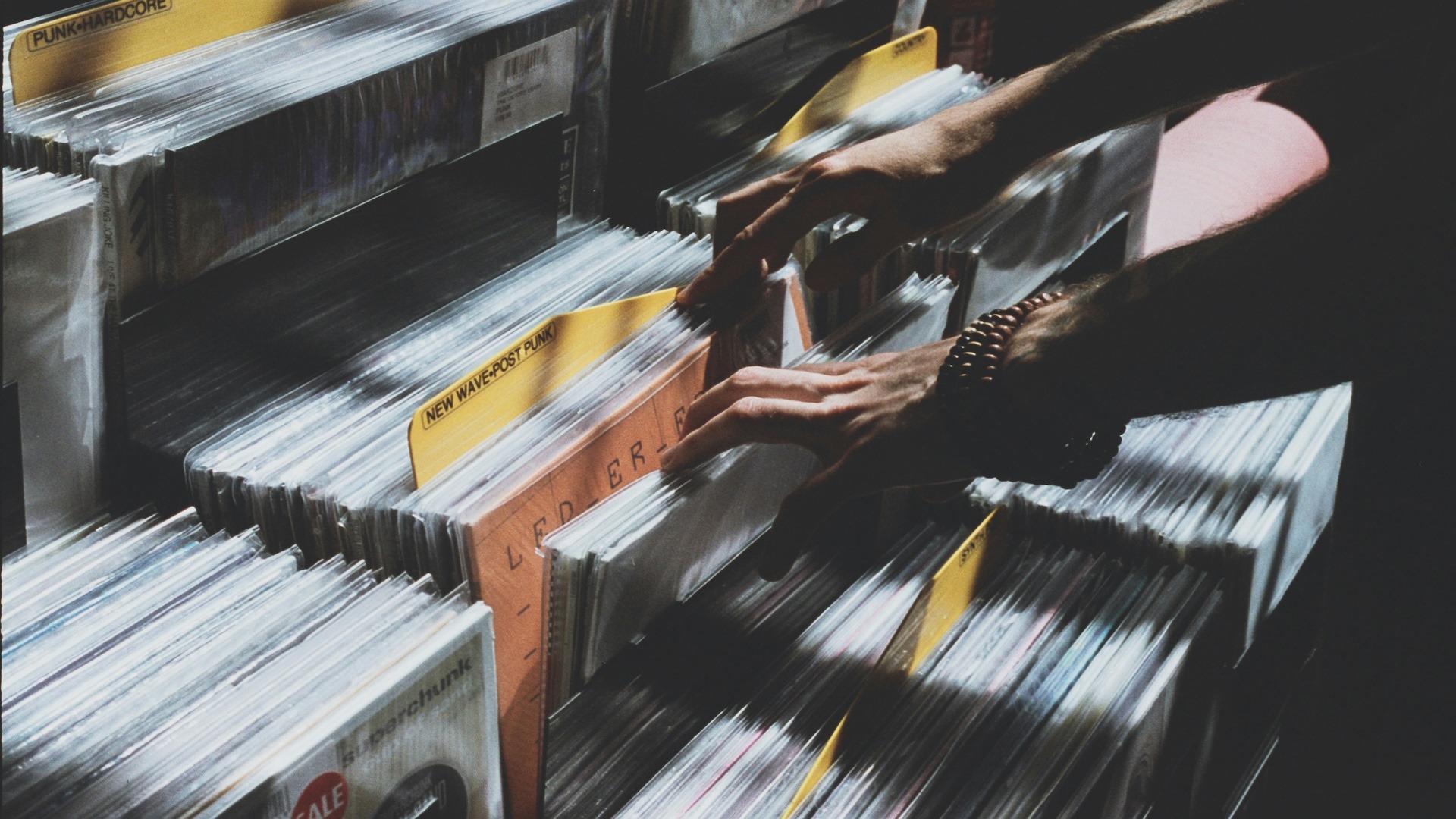 Person looking through vinyls in a record store